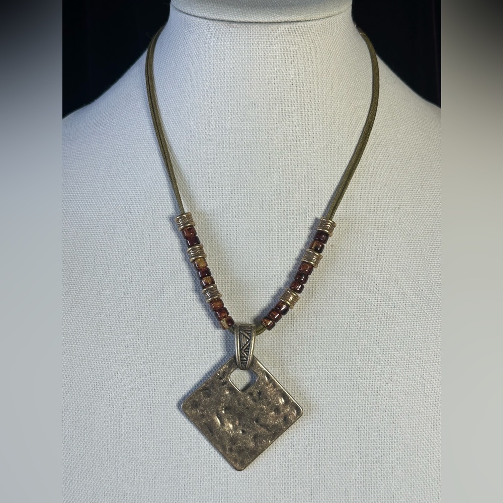 Necklace on leather chain.
